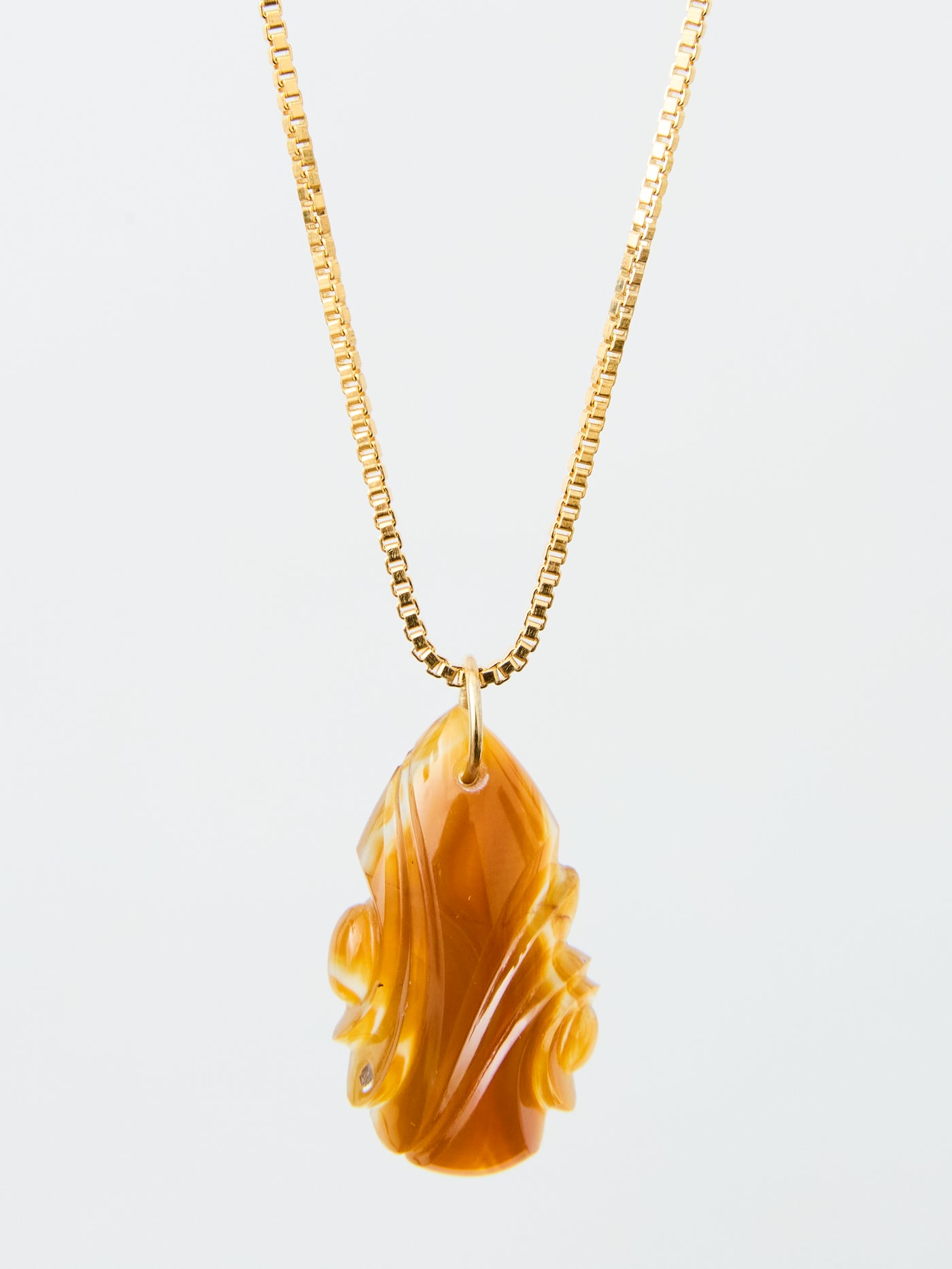 Carved Coyomito Agate Pendant